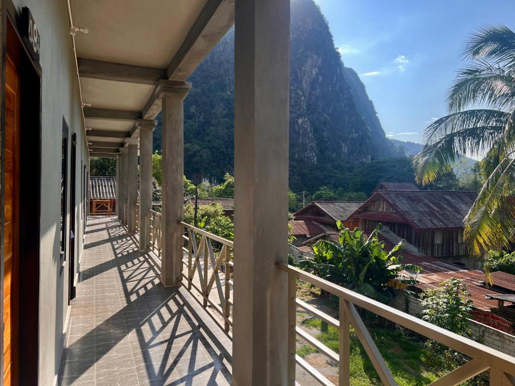 a balcony with a view of a mountain at Valley Villa Hotel in Nongkhiaw