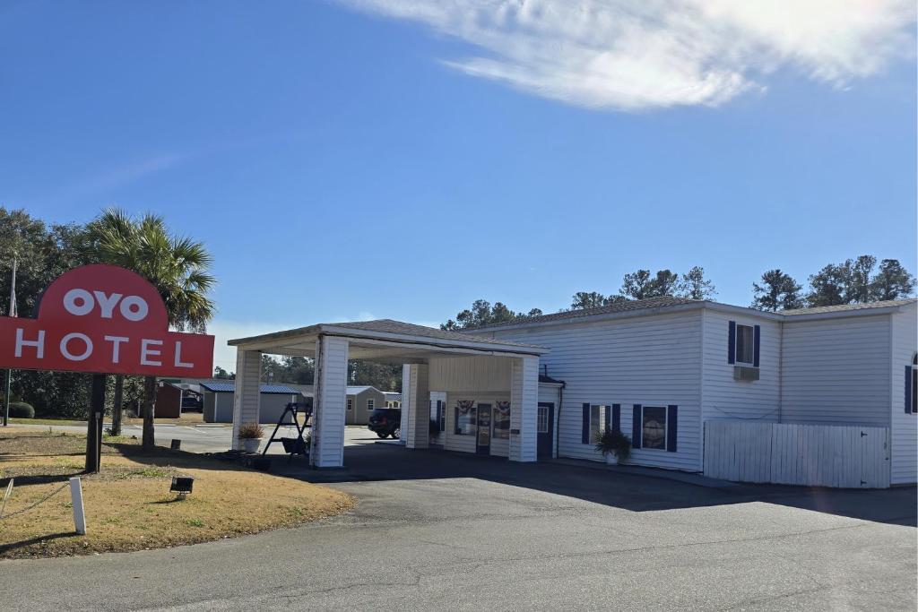 a two hotel sign in front of a building at OYO Hampton South Carolina Hwy 278 in Hampton-Varnville Airport