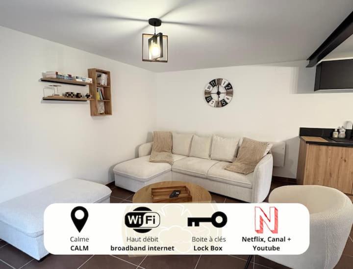 a living room with a couch and a table at Nuit D'or - Escapade à Pierry - Séjour & Pro in Pierry