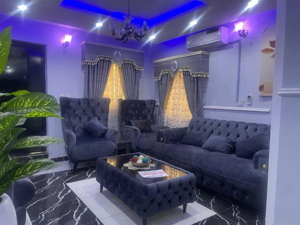 a living room with a couch and a table at Muniz Apartments in Lagos
