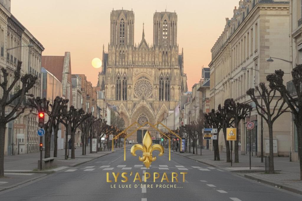 an empty street in front of a large cathedral at Lys Appart in Reims