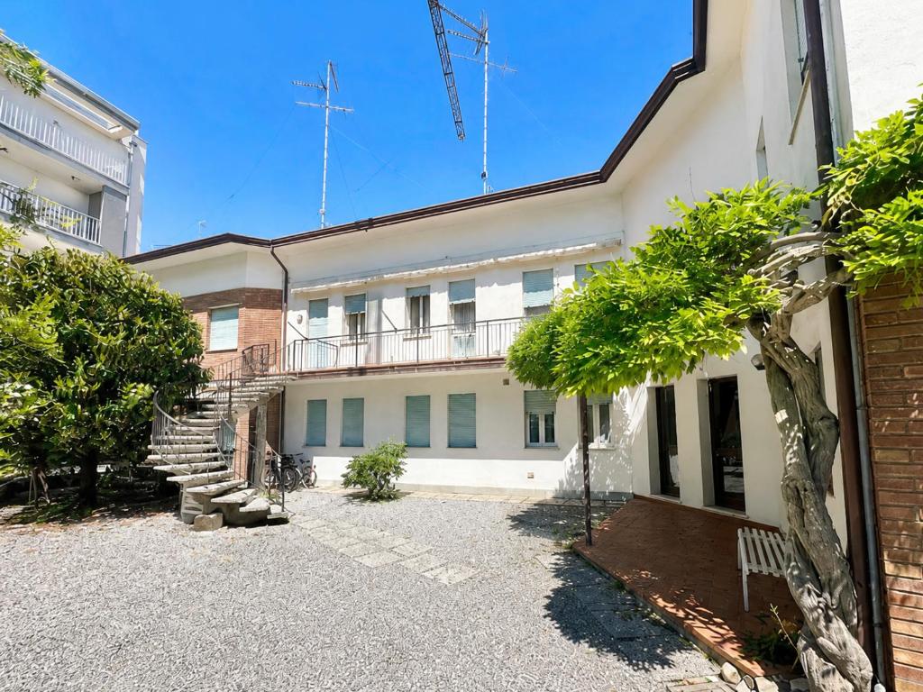 an exterior view of a building with a staircase at Casa Francesca - Agenzia Cocal in Caorle