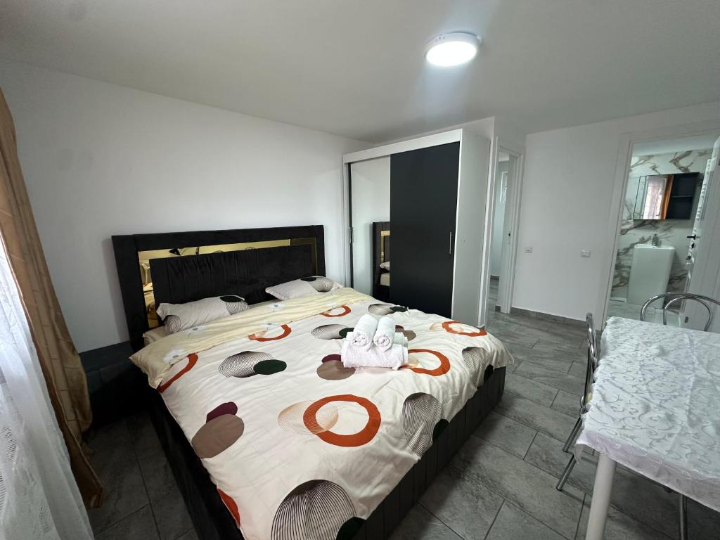 a bedroom with a bed with a teddy bear on it at Nord Accomodation in Bucharest