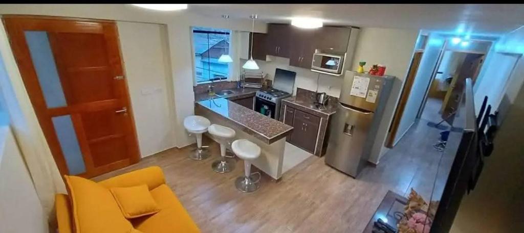 an overhead view of a kitchen with a counter top at Cozy Apartment in PUNO in Puno