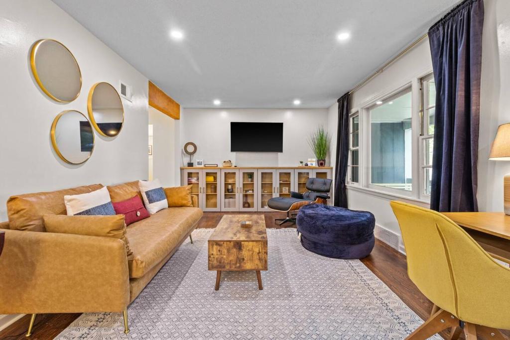 a living room with a couch and a table at Bright 3BR | 25 mins to Arrowhead | Groups & Pets in Mission
