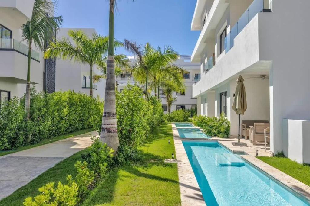 an image of a swimming pool in a villa at Private Beach Community - White Sands Golf Resort - Modern 2BR Private Pool and Patio in Punta Cana