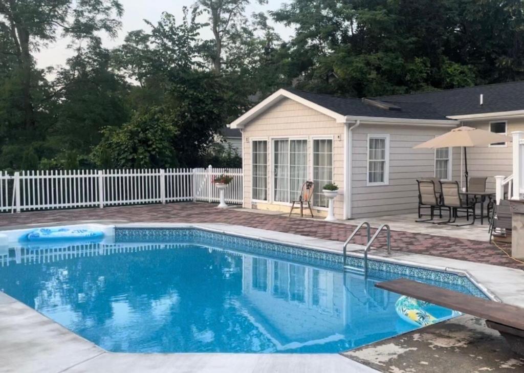 a swimming pool in front of a house at The Great Escape in Clintondale