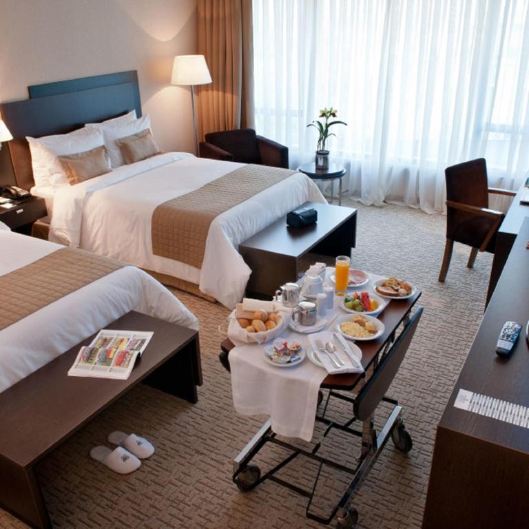 Postel nebo postele na pokoji v ubytování Gran Bourbon Hotel Asuncion