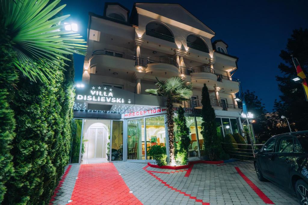 a building with a red carpet in front of it at Villa Dislievski in Ohrid