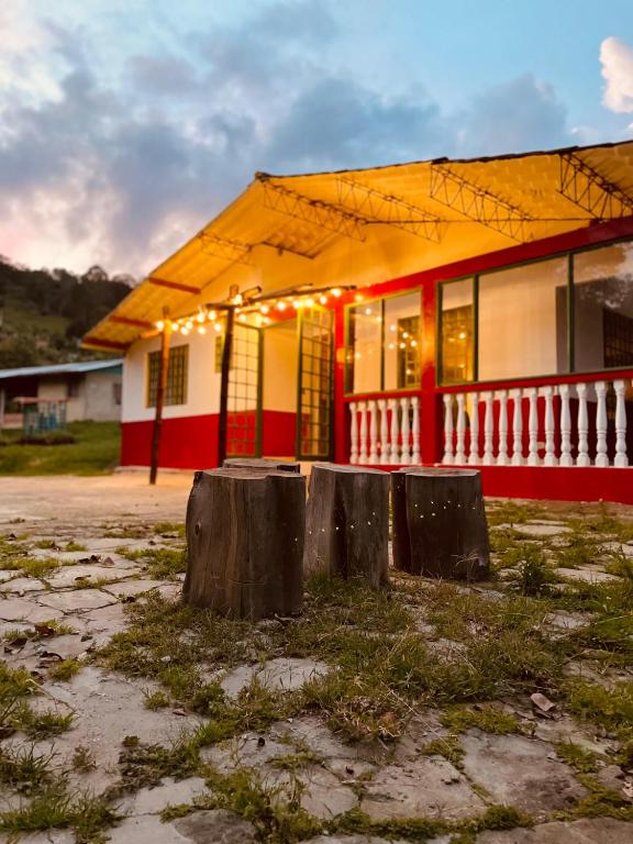 a red and white building with lights on it at La finca de dulce in Silvania