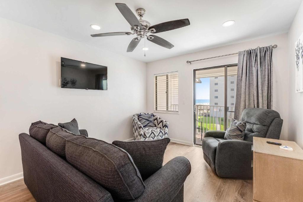 a living room with two couches and a ceiling fan at Plantation East #3312 in Gulf Highlands