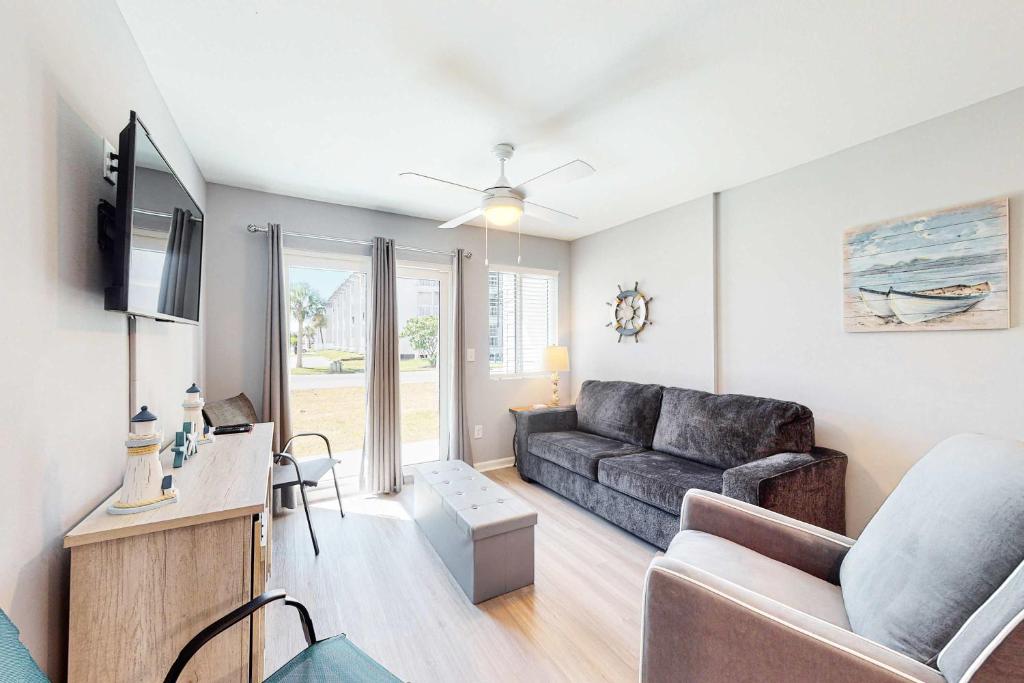 a living room with a couch and a table at Plantation East #4113 in Fort Morgan