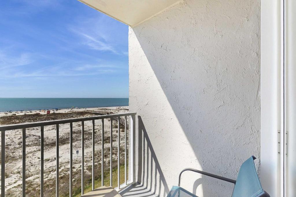 a balcony with a view of the beach at Contemporary beachside escape with gym & pools in Fort Morgan