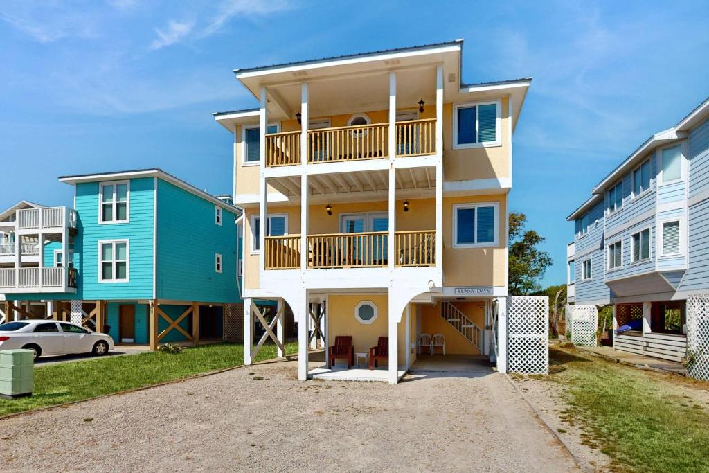 a large apartment building with balconies and condos at Gulf view duplex with multi-level balcony hot tub in Fort Morgan