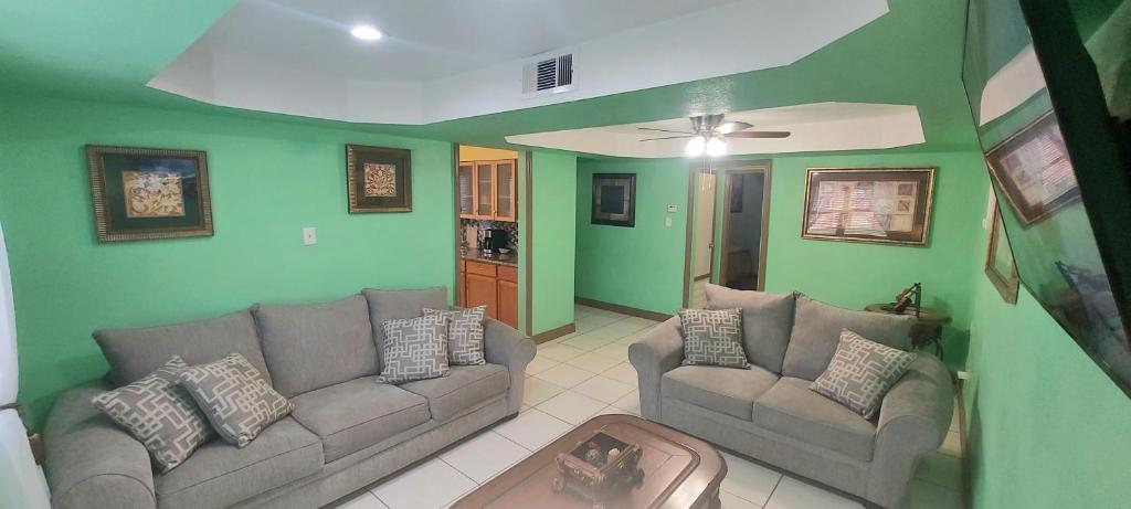 a living room with two couches and a ceiling at Great location to explore Houston in Houston