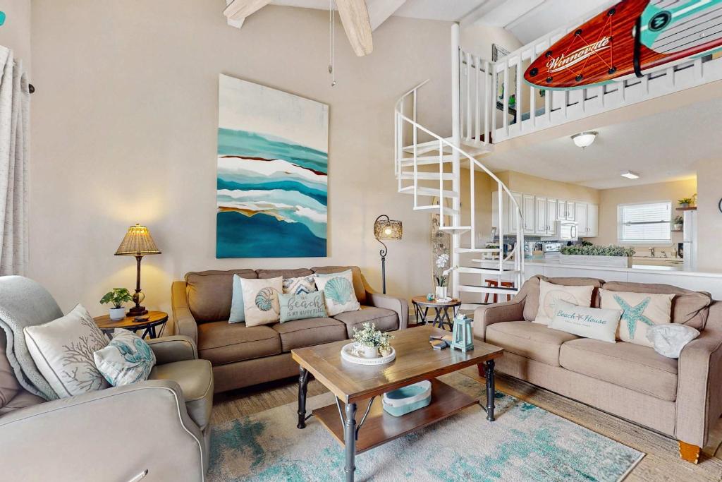 Waterfront condo with shared outdoor pool furnished balcony & beach access