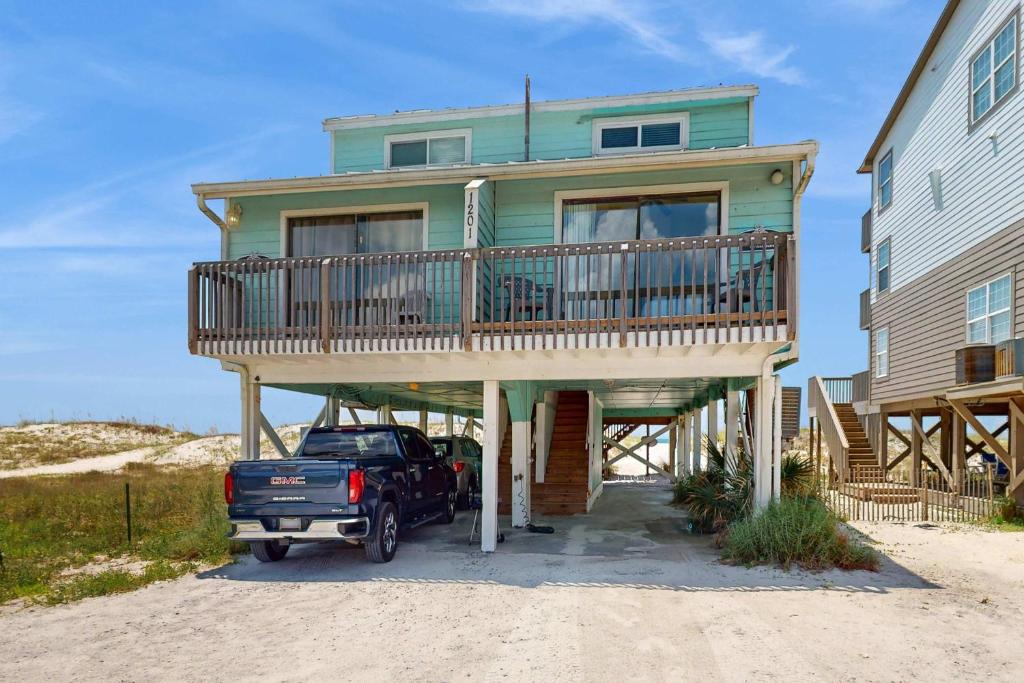 a truck parked in front of a house at Sweet Alabama in Gulf Shores