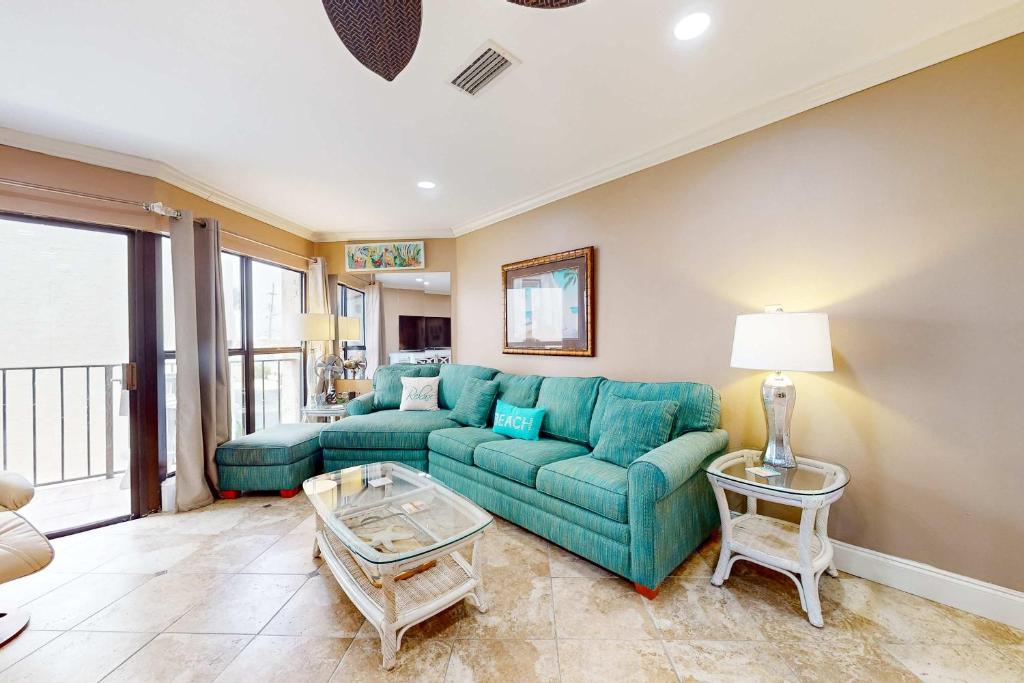 a living room with a couch and a table at Gulfside Townhomes 23 in Gulf Shores