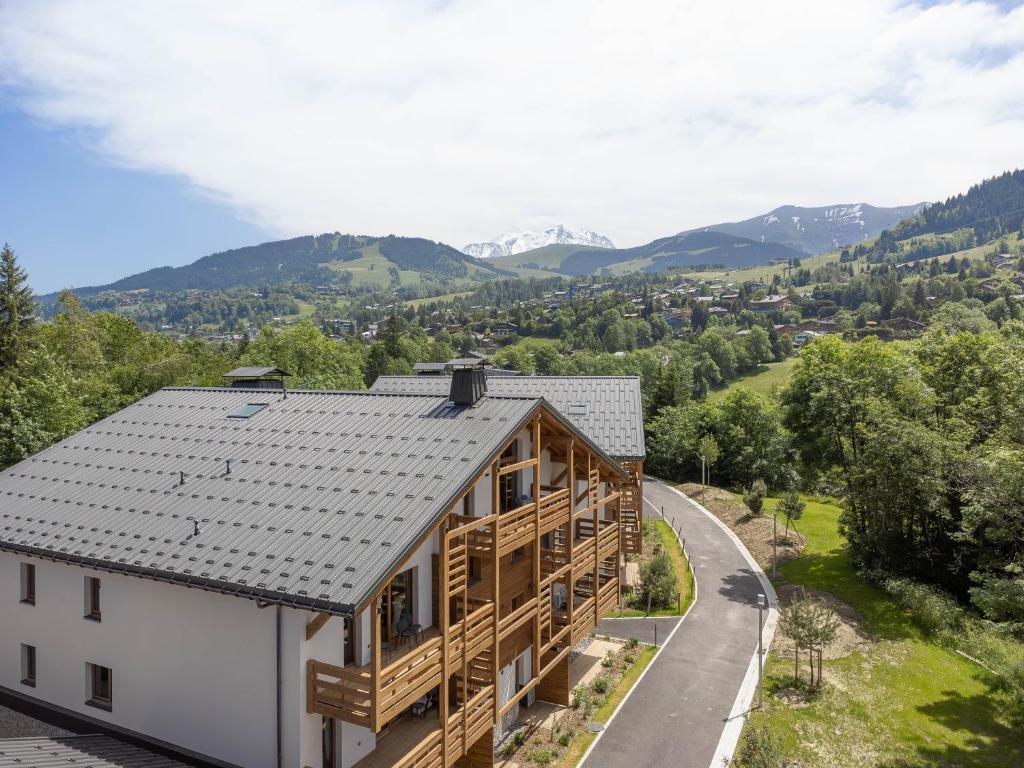 a house in the mountains with a view at L'Altima Megève in Megève