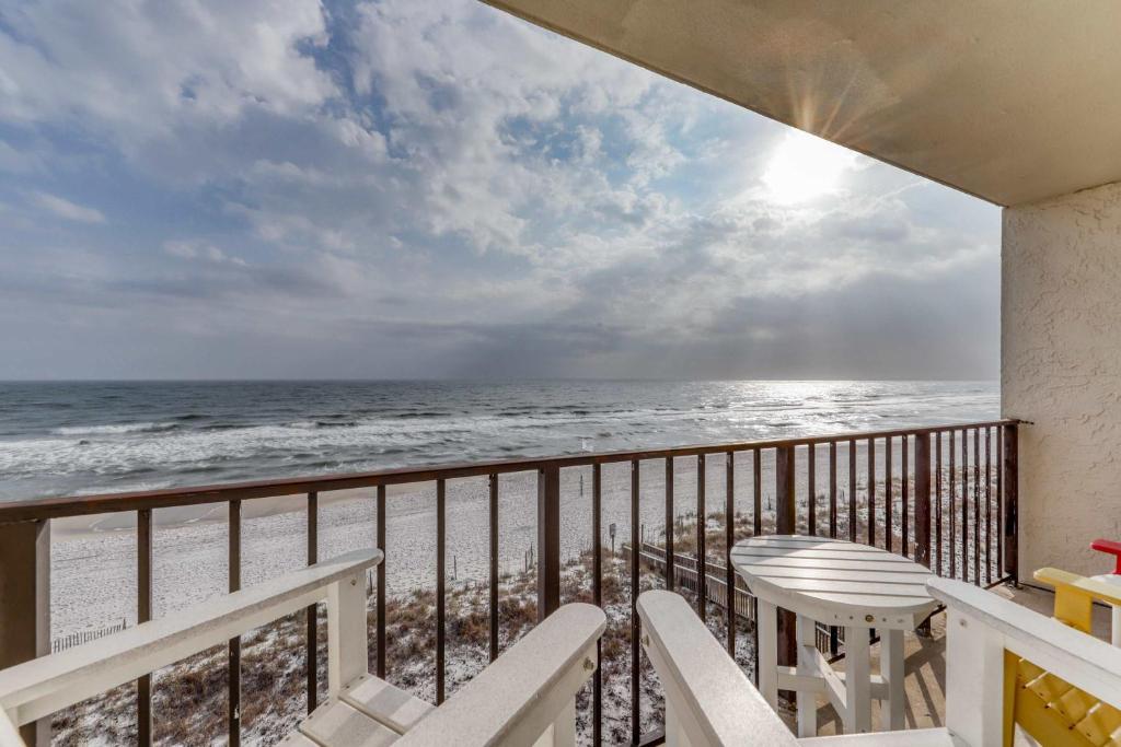 a balcony with a view of the beach at Gulf front condo with great views shared pools & beach access in Orange Beach