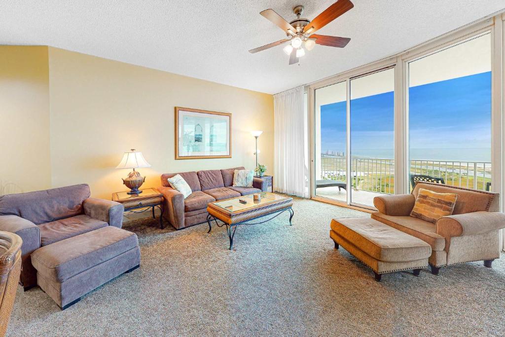 a living room with a couch and a table at Caribe PHB12 in Orange Beach
