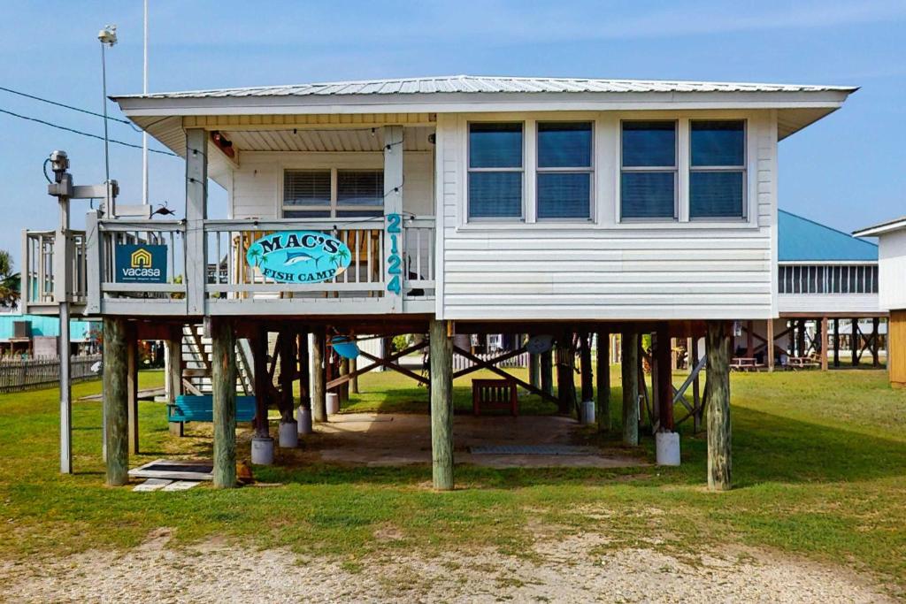 a house on a pier on the beach at Macs Fish Camp in Dauphin Island