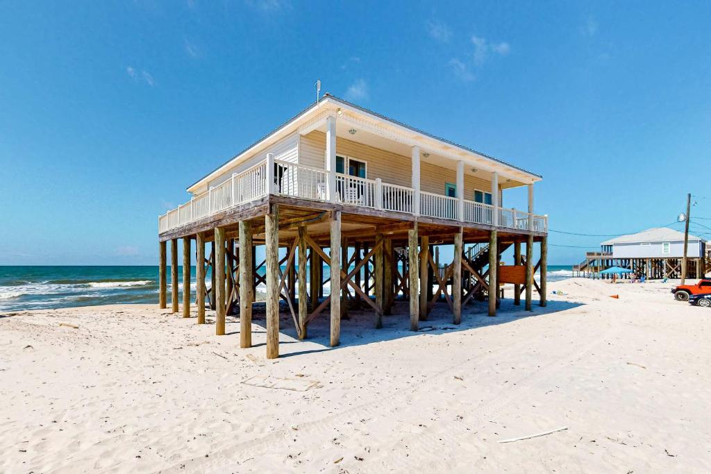 a wooden house on the beach with the ocean at Sea the Gulf in Dauphin Island