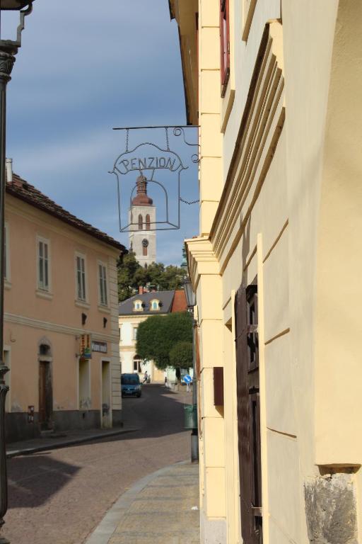a view of a street with a building and a clock tower at Penzion U Brány in Kutná Hora