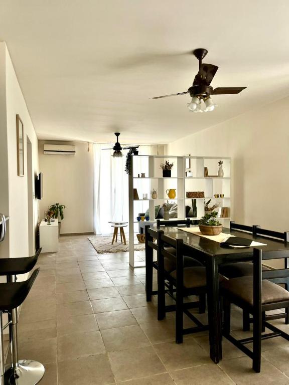 a living room with a dining room table and chairs at Casa Akbar in La Cieneguita