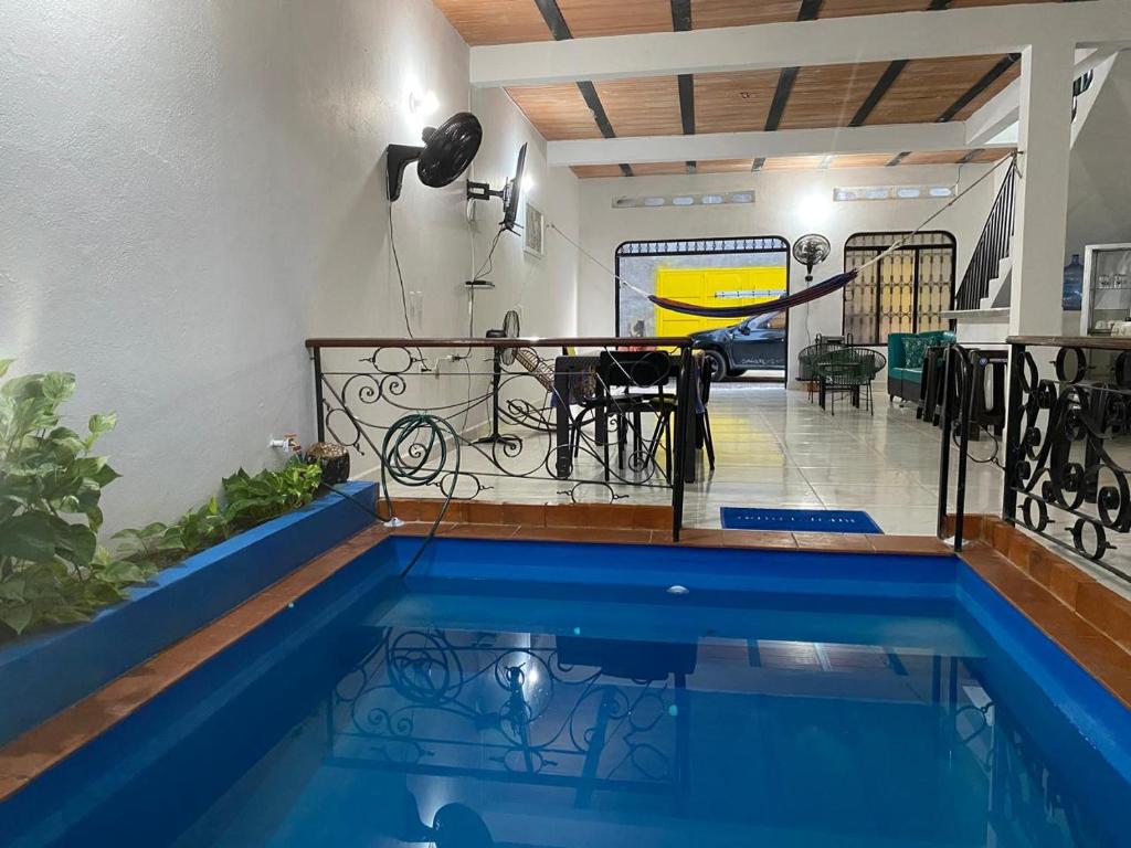 a house with a swimming pool and a table at Casa Armonia in Honda