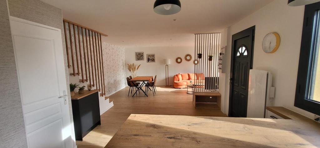 a hallway with a living room and a dining room at Maison au calme in Nogent-sur-Eure