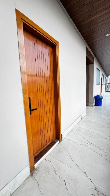 a wooden door in the side of a building at Hotel Chhaya in Rishīkesh