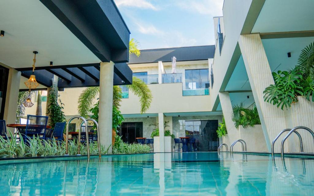 a view of a swimming pool at a resort at Pousada Caribdis in Paraipaba