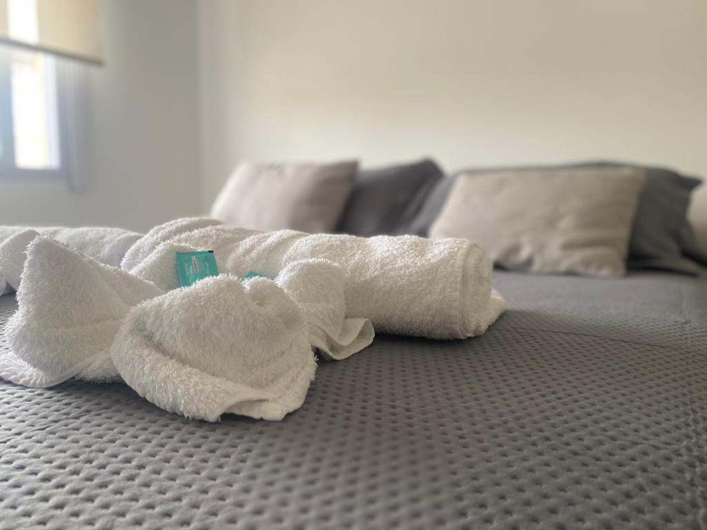 a towel animal laying on top of a bed at Namante in Balcarce