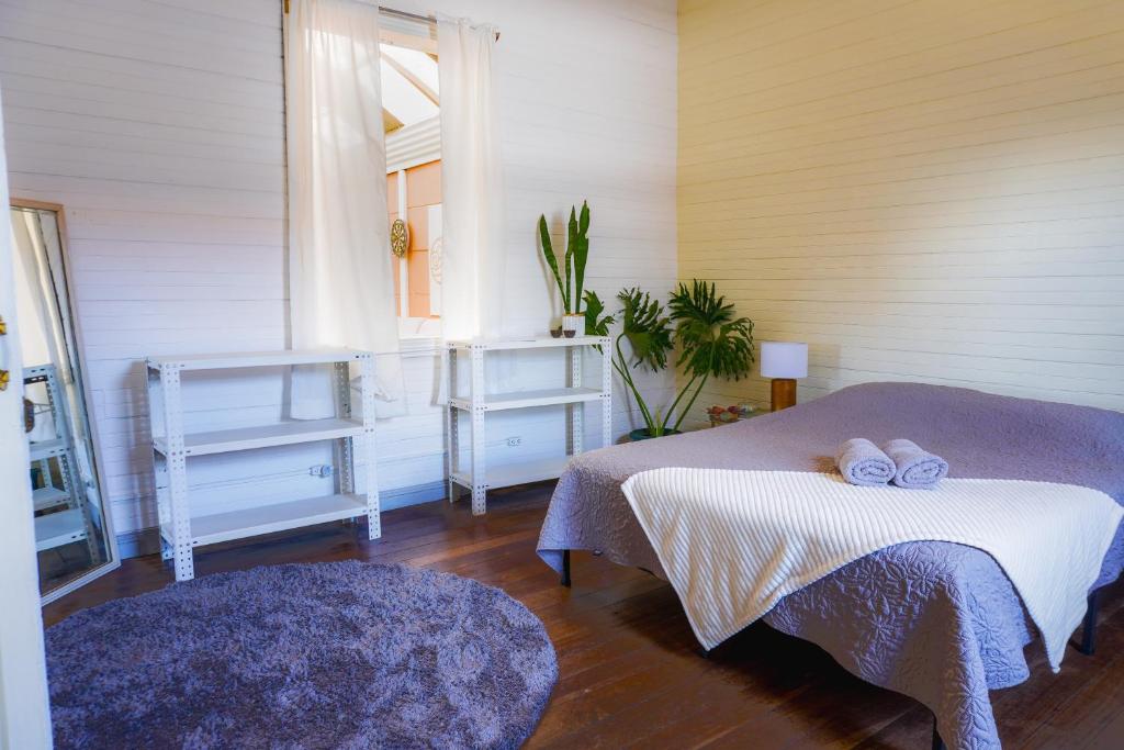 a bedroom with two beds and a window at The Nomad Hostel - SJO Airport San Jose 5 min - Private, WiFi & Coffee in Alajuela