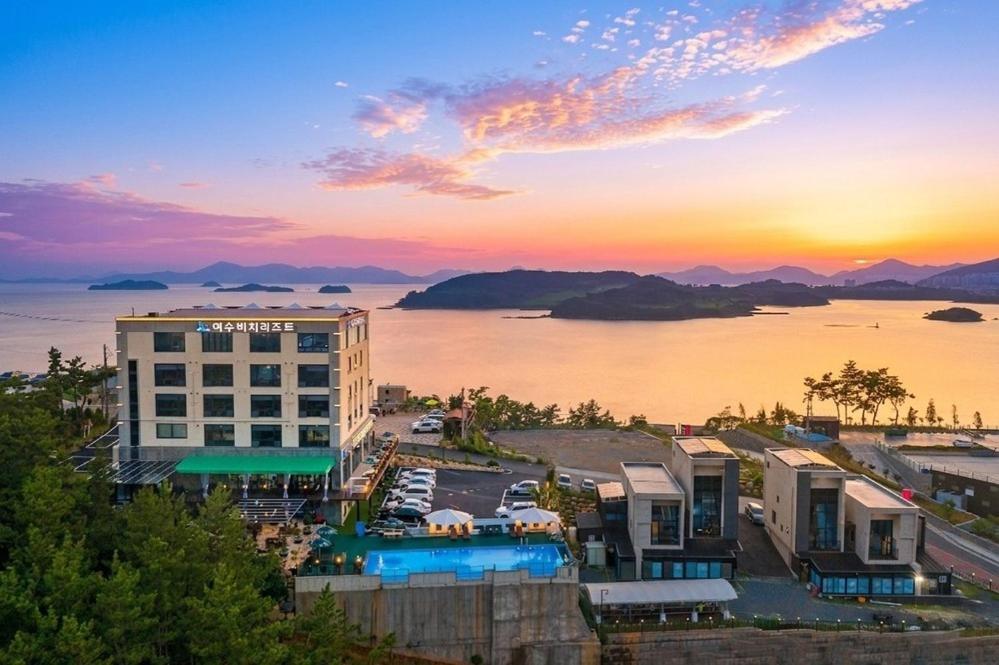a view of a hotel with a view of the water at Oceanview Spa Beach Resort Yeosu in Yeosu