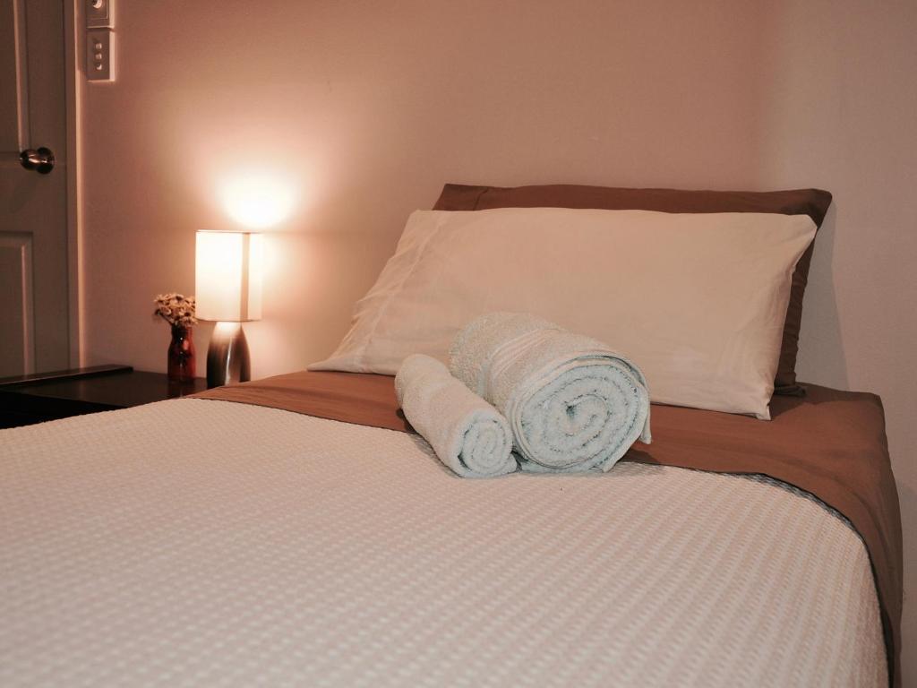 Postel nebo postele na pokoji v ubytování TL Warmest Homestay