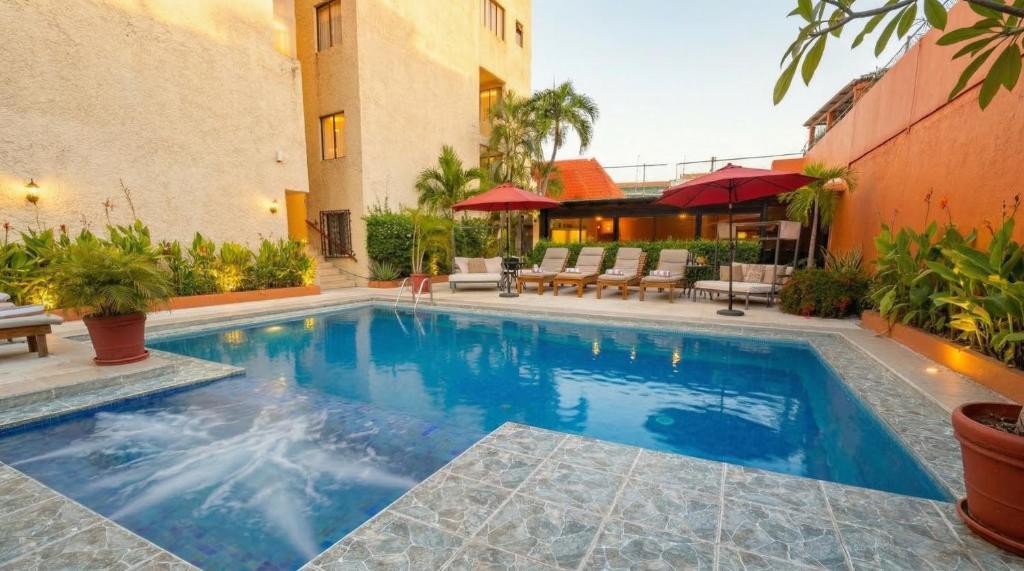 a swimming pool in the middle of a building at Zihua Mia Hotel Boutique in Zihuatanejo