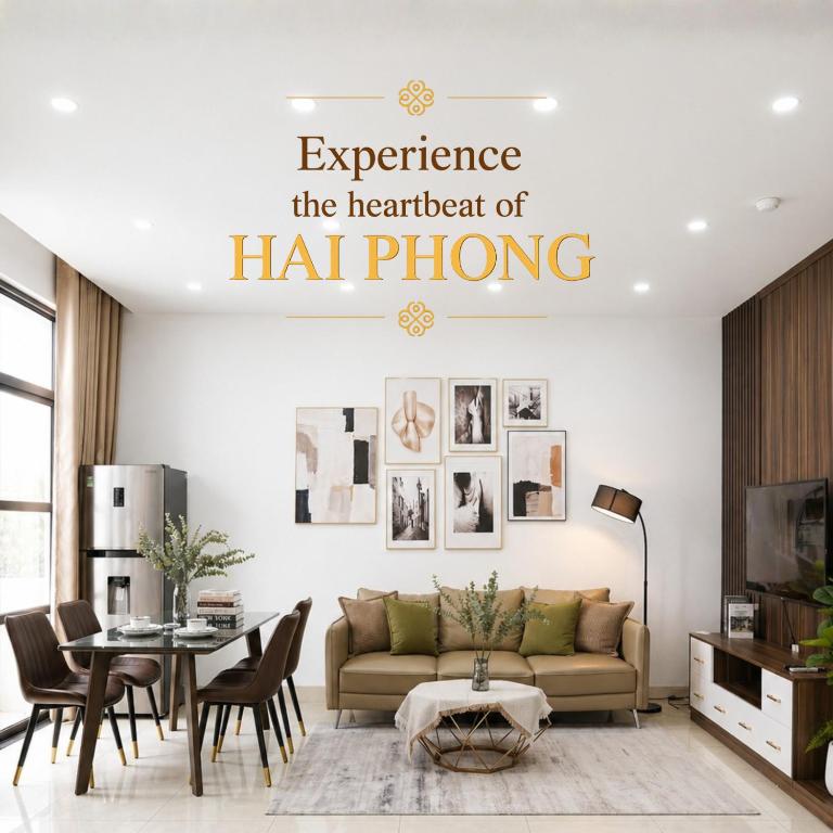 a living room with a couch and a table at Merci Vinhomes Imperia Hai Phong in Hai Phong