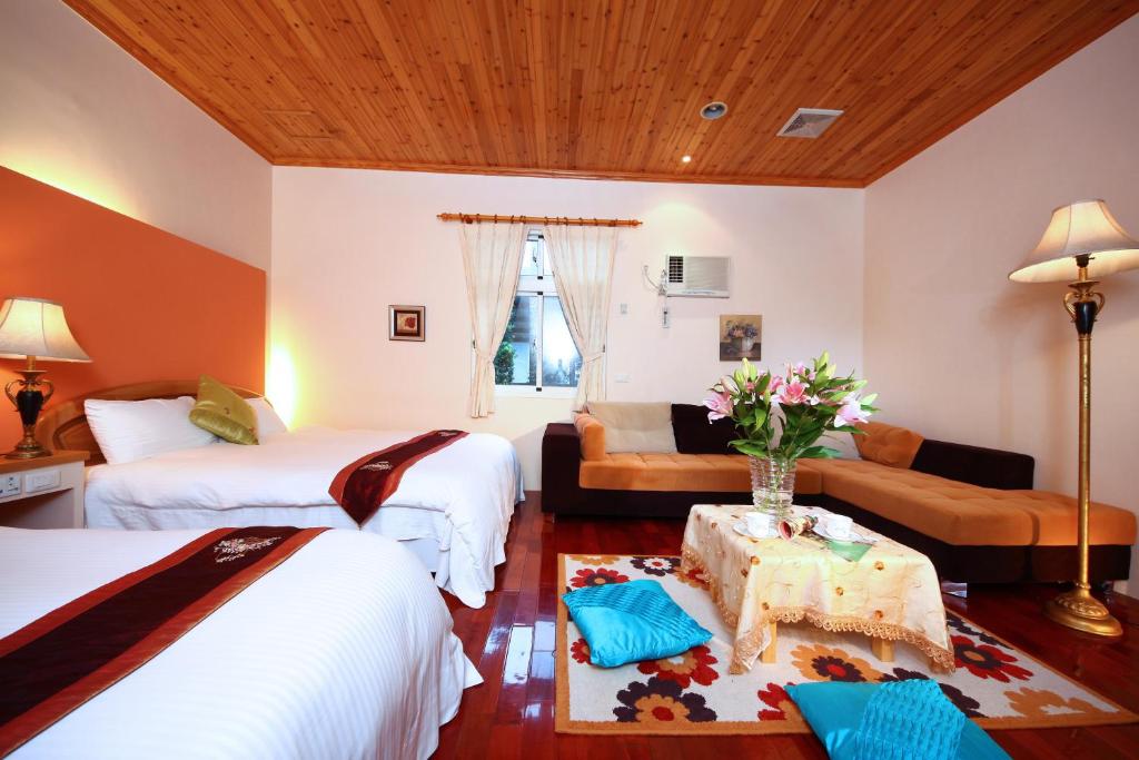 Postel nebo postele na pokoji v ubytování Zhen Shan Zhuang B&B