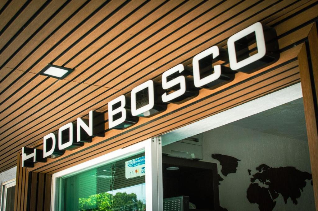 a sign on the front of a domacco store at Hotel don Bosco in Guadalajara