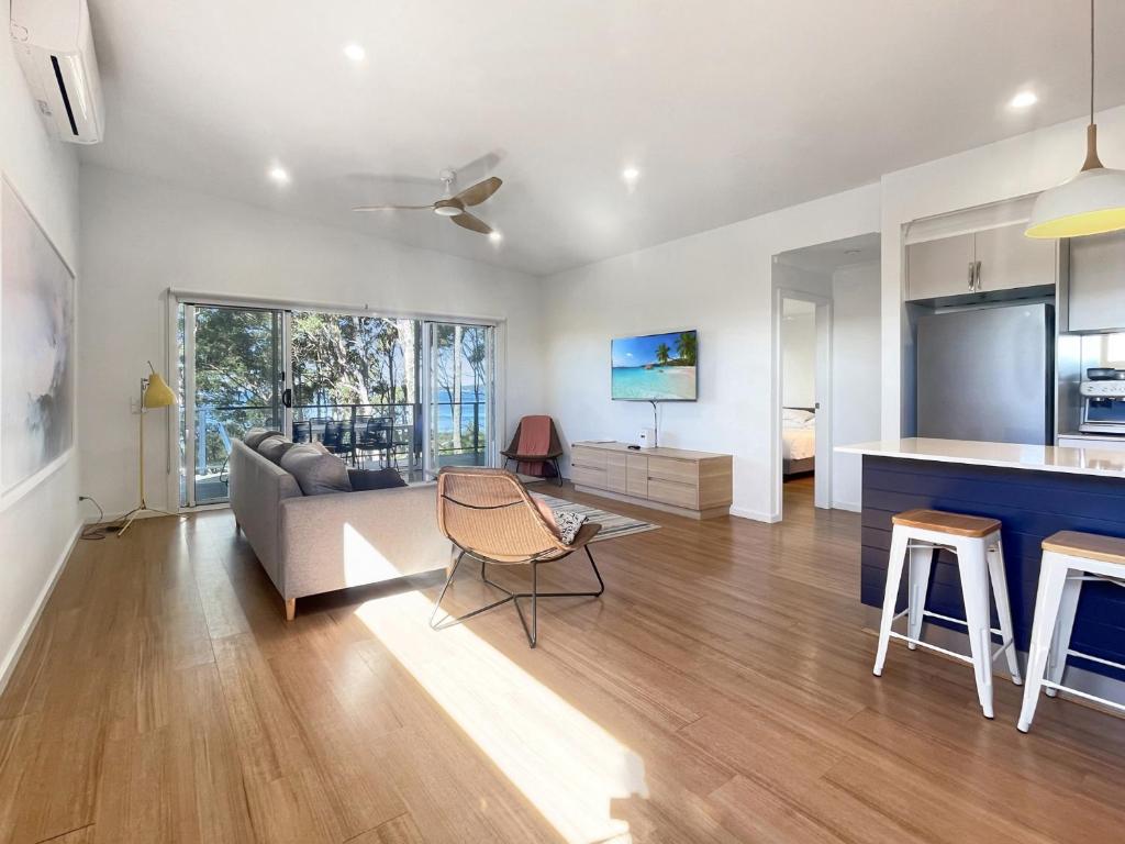 a living room with a couch and a table at Pet-Friendly 3-Bed Coastal Gem Near Long Beach in Long Beach
