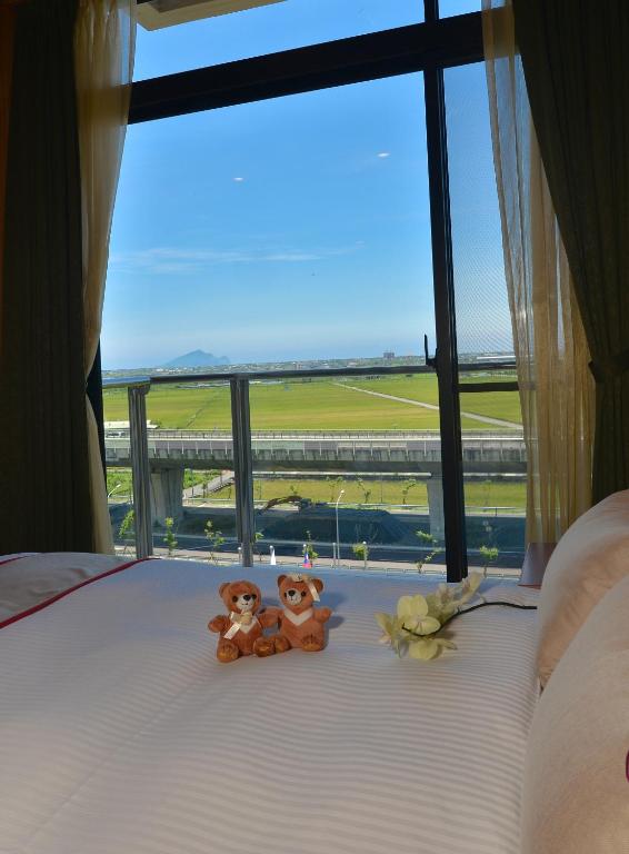 Postel nebo postele na pokoji v ubytování Shandori Hotel