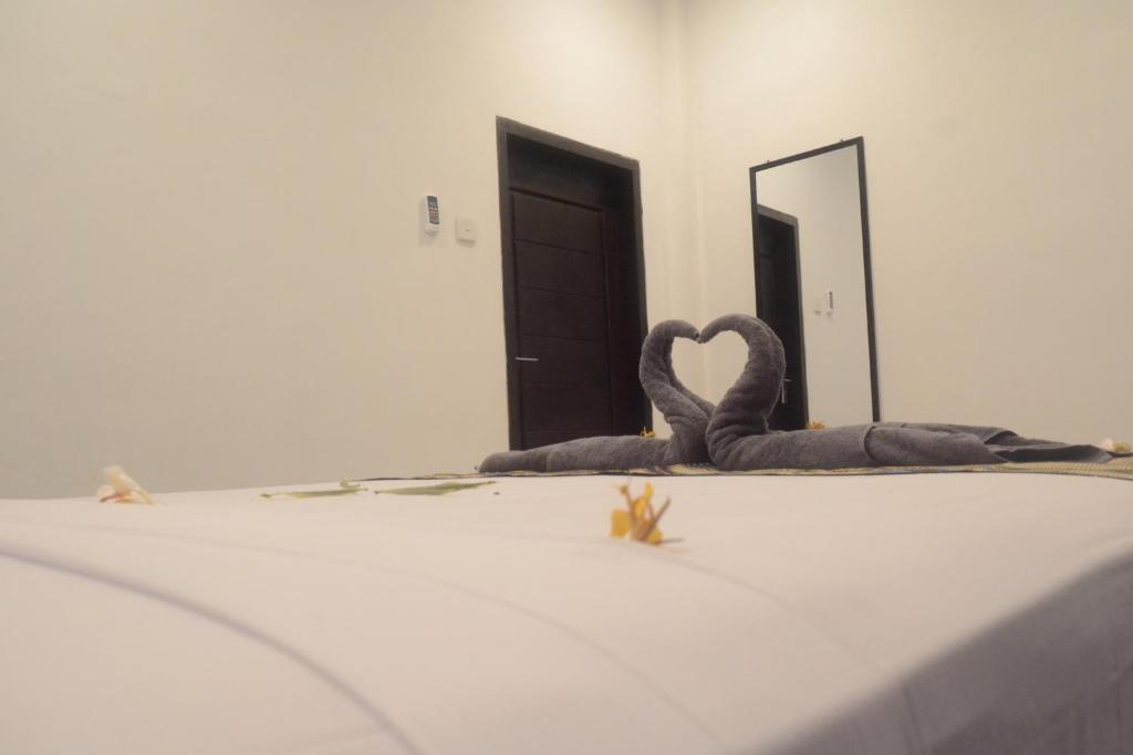 Postel nebo postele na pokoji v ubytování Akalanka Homestay