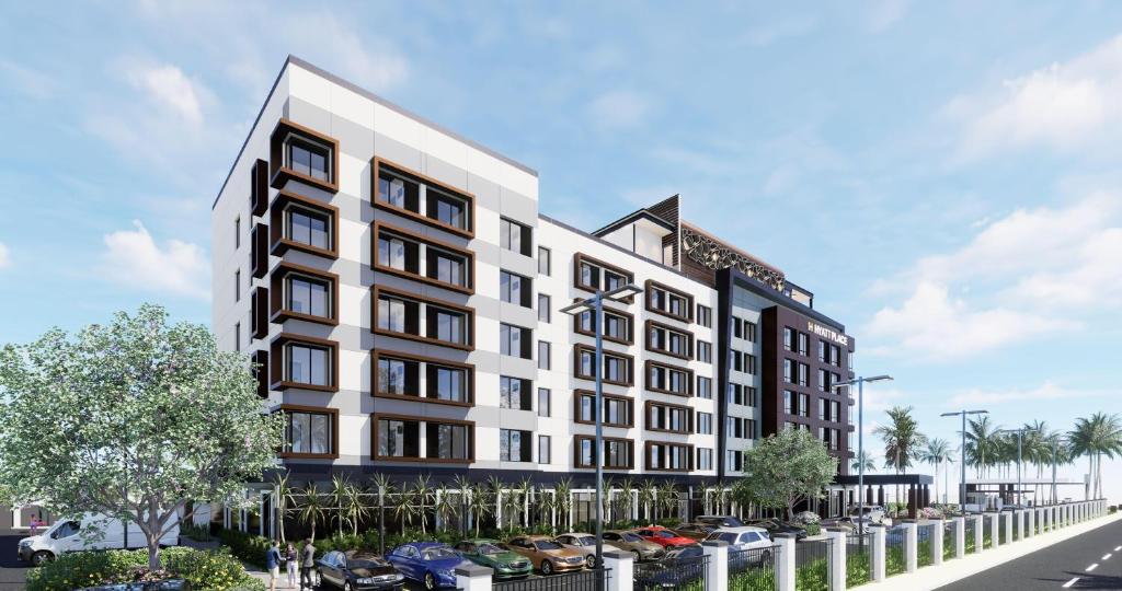 a rendering of a building with cars in a parking lot at Hyatt Place Guyana Georgetown in Georgetown