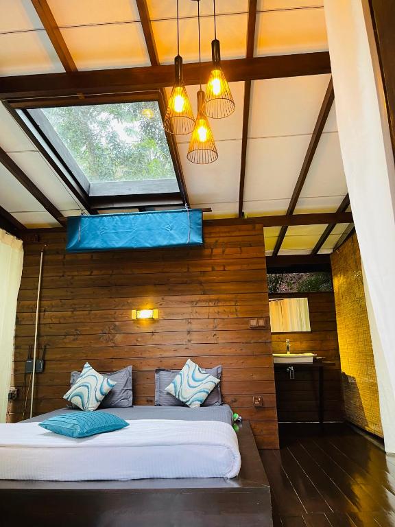a bed in a room with a window at The Mist in Ella