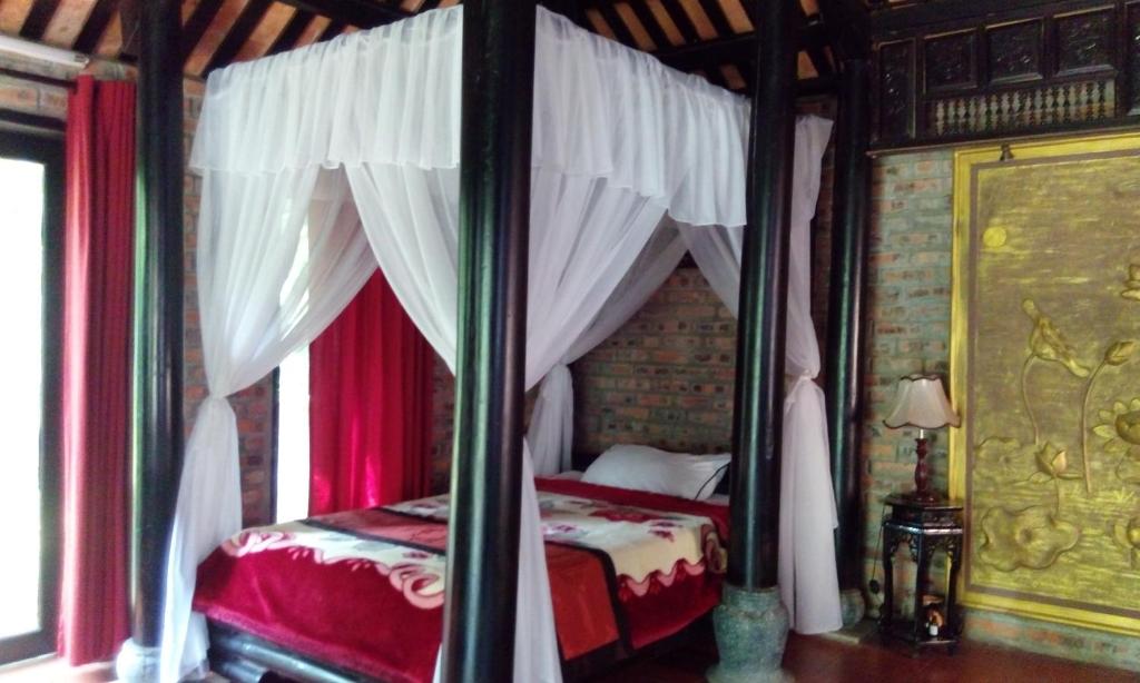 Postel nebo postele na pokoji v ubytování Tam Tinh Vien Homestay