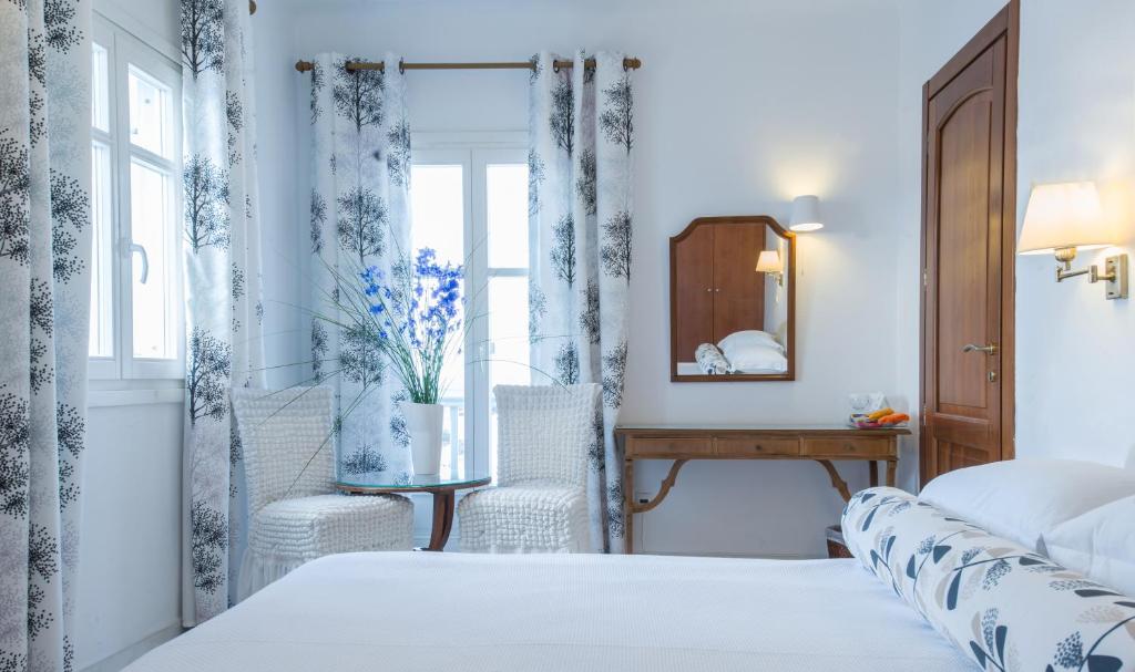 Postel nebo postele na pokoji v ubytování Hotel Adonis