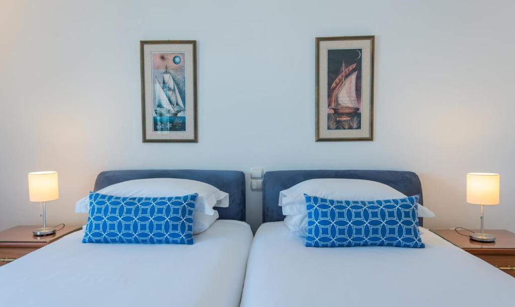 Postel nebo postele na pokoji v ubytování Hotel Adonis