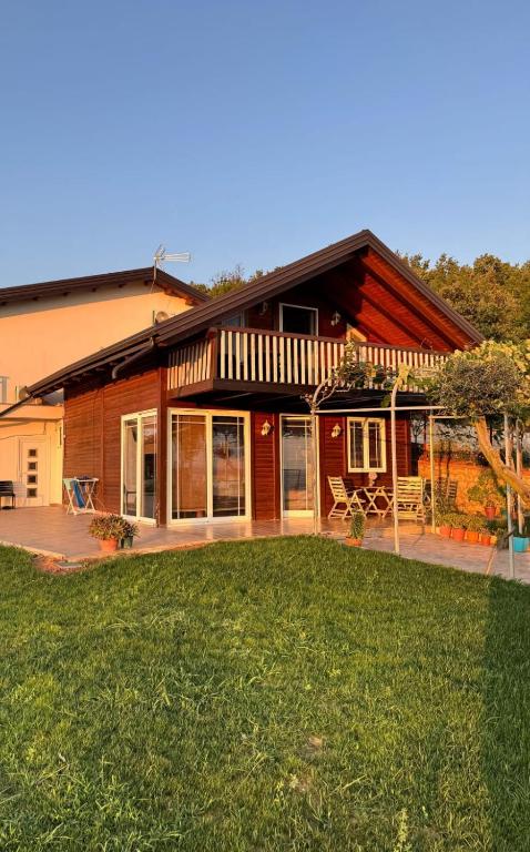 a house with a lawn in front of it at Sol Apartments in Durrës